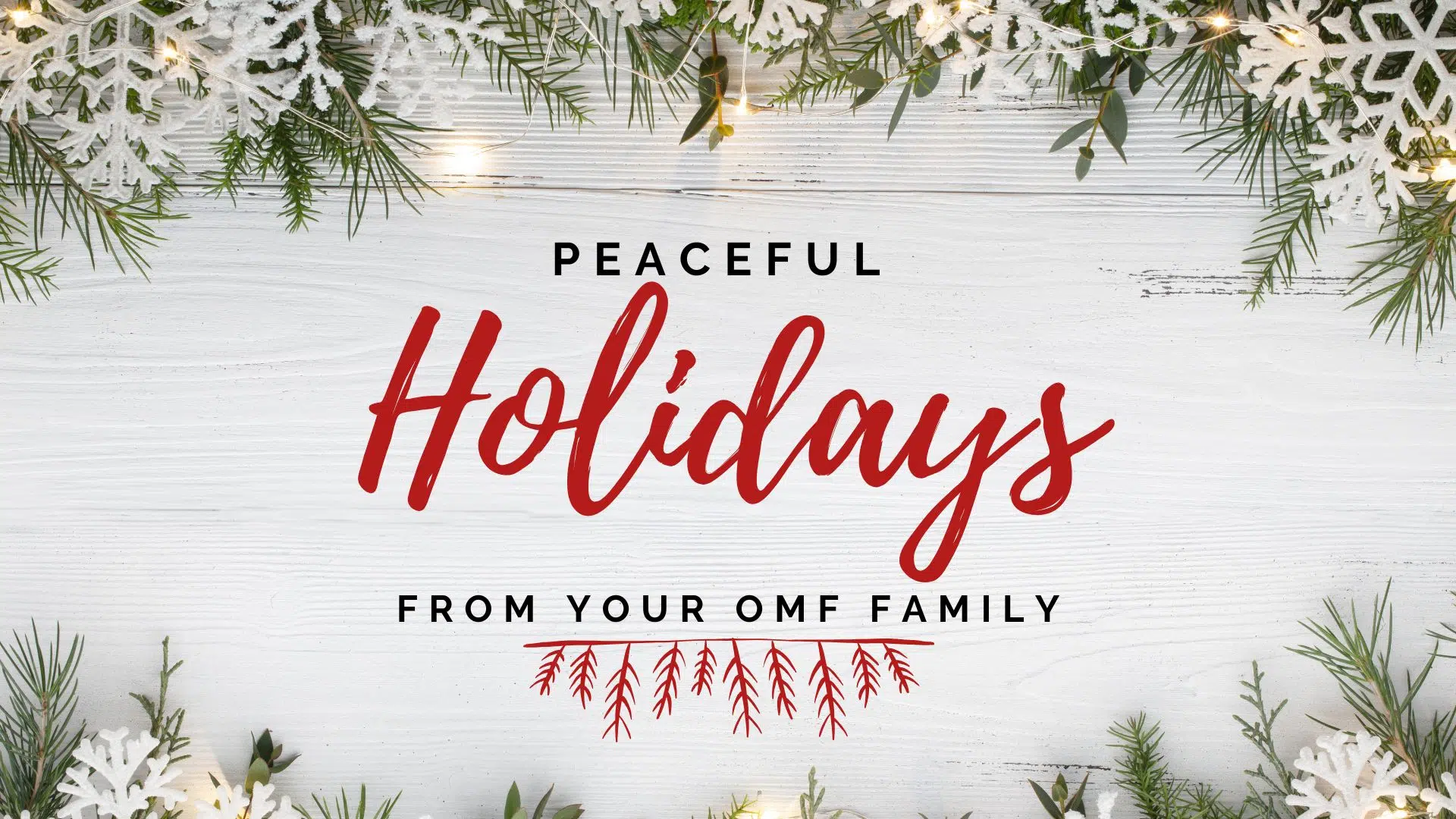 Holiday greeting graphic with greenery and lights framing the message, “Peaceful Holidays from your OMF family.”